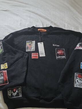 Unisex Black Crewneck Sweatshirt with Patch Graphics